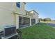 View of house exterior with screened patio and landscaping at 439 Annabelle Way, Davenport, FL 33837
