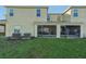 Exterior view showing two-story house with screened patio at 439 Annabelle Way, Davenport, FL 33837