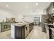 Spacious kitchen with granite countertops and stainless steel appliances at 439 Annabelle Way, Davenport, FL 33837