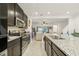 Modern kitchen island overlooks Gathering room, offering an open concept at 439 Annabelle Way, Davenport, FL 33837