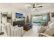 Bright living room featuring a comfy seating area and sliding glass doors leading to a patio at 439 Annabelle Way, Davenport, FL 33837