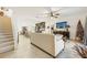 Open-concept living room with a view of the kitchen and stairs at 439 Annabelle Way, Davenport, FL 33837