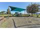 playground with shade structure, swings, and slide at 439 Annabelle Way, Davenport, FL 33837
