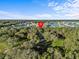 Aerial view of property located near water and community at 5100 Helen Ct, St Cloud, FL 34772