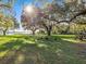 Spacious backyard with large oak trees and picnic table at 5100 Helen Ct, St Cloud, FL 34772