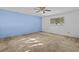 Bedroom with light blue accent wall and carpeting at 5100 Helen Ct, St Cloud, FL 34772