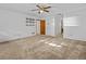 Bright bedroom featuring ceiling fan and ample closet space at 5100 Helen Ct, St Cloud, FL 34772