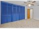Bedroom with blue closet doors and carpet flooring at 5100 Helen Ct, St Cloud, FL 34772