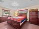 Spacious bedroom with large bed and ample storage at 5100 Helen Ct, St Cloud, FL 34772