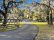 Long private driveway leading to home with mature oak trees at 5100 Helen Ct, St Cloud, FL 34772