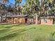 Brick home with attached garage and large yard at 5100 Helen Ct, St Cloud, FL 34772