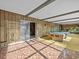 Sunlit game room with pool table and access to backyard at 5100 Helen Ct, St Cloud, FL 34772