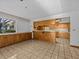 Kitchen features wood cabinets and tile flooring at 5100 Helen Ct, St Cloud, FL 34772