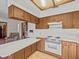 Kitchen offers ample counter space and wood cabinets at 5100 Helen Ct, St Cloud, FL 34772