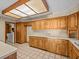 Kitchen with wood cabinets and access to laundry at 5100 Helen Ct, St Cloud, FL 34772