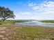 Peaceful lakefront property with lush vegetation at 5100 Helen Ct, St Cloud, FL 34772