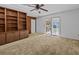 Living area with built-in shelving and access to patio at 5100 Helen Ct, St Cloud, FL 34772