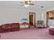 Living room boasts a large couch and chair with wood accents at 5100 Helen Ct, St Cloud, FL 34772