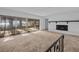 Bright living room with fireplace and sliding glass doors leading to a view at 5100 Helen Ct, St Cloud, FL 34772