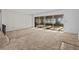 Spacious living room featuring sliding glass doors and carpeting at 5100 Helen Ct, St Cloud, FL 34772