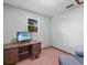 Home office with a desk and chair near a window at 5100 Helen Ct, St Cloud, FL 34772