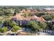 Aerial view of condo building with parking and landscaping at 6141 Metrowest Blvd # 307, Orlando, FL 32835