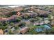 Aerial view of community pool, tennis courts, and buildings at 6141 Metrowest Blvd # 307, Orlando, FL 32835