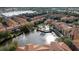 Aerial view of community with lake and pool at 6141 Metrowest Blvd # 307, Orlando, FL 32835