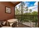 Screened balcony with seating area and treetop views at 6141 Metrowest Blvd # 307, Orlando, FL 32835
