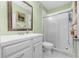 Clean bathroom with white vanity, shower, and mirror at 6141 Metrowest Blvd # 307, Orlando, FL 32835