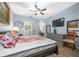 Bright bedroom with a comfortable bed and views into the living area and bathroom at 6141 Metrowest Blvd # 307, Orlando, FL 32835
