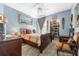 Bedroom with a wooden sleigh bed, and walk in closet at 6141 Metrowest Blvd # 307, Orlando, FL 32835
