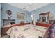 Bedroom with a sleigh bed, dresser, and decorative wall art at 6141 Metrowest Blvd # 307, Orlando, FL 32835