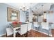 Bright dining area with table and chairs, open to kitchen at 6141 Metrowest Blvd # 307, Orlando, FL 32835