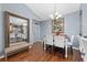 Dining area with table and chairs near entry and kitchen at 6141 Metrowest Blvd # 307, Orlando, FL 32835