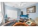 Bright home office features built-in desk, hardwood floors, and ample storage at 6141 Metrowest Blvd # 307, Orlando, FL 32835