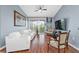 Living room with white couches and access to balcony at 6141 Metrowest Blvd # 307, Orlando, FL 32835