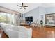 Living room features hardwood floors and balcony access at 6141 Metrowest Blvd # 307, Orlando, FL 32835