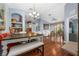 Open concept living and dining area with hardwood floors at 6141 Metrowest Blvd # 307, Orlando, FL 32835
