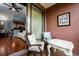 Private patio with seating area, view of living room, and sliding door access at 6141 Metrowest Blvd # 307, Orlando, FL 32835