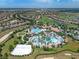 Aerial view of community amenities including pools and a clubhouse at 9022 Stinger Dr, Davenport, FL 33896
