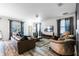 Spacious living room with leather furniture and large TV at 9022 Stinger Dr, Davenport, FL 33896