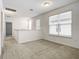 Upstairs hallway with carpet and access to bedrooms at 10414 Austrina Oak Loop, Winter Garden, FL 34787