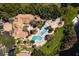Aerial view of resort-style pool and clubhouse with lush landscaping at 1150 Lake Shadow Cir # 3304, Maitland, FL 32751