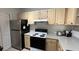 Kitchen with light wood cabinets and stainless steel appliances at 1150 Lake Shadow Cir # 3304, Maitland, FL 32751