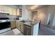 Kitchen with light cabinets, stainless steel appliances, and breakfast bar at 1150 Lake Shadow Cir # 3304, Maitland, FL 32751