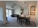 Open concept living and dining area with grey sofa and balcony access at 1150 Lake Shadow Cir # 3304, Maitland, FL 32751