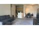 Open living and dining area with grey sofa and dark dining table at 1150 Lake Shadow Cir # 3304, Maitland, FL 32751