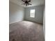 Spacious bedroom with ceiling fan and carpeted flooring at 13565 Fountainbleau Dr, Clermont, FL 34711