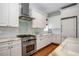 Well-equipped kitchen featuring stainless steel appliances and light-colored cabinetry at 1401 Craftsman E Ave, Kissimmee, FL 34747